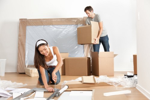 Commercial moving team handling office equipment